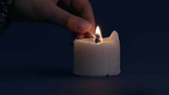 single white candle burning funeral death obituary peace background light candle light white