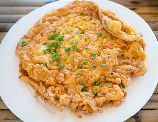 Crispy omelette with onion leaves, Thai style crab fried eggs.