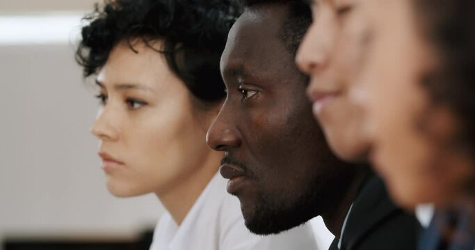 Close up pull focus of business team talking.