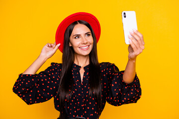 Naklejka premium Photo of cute sweet young lady dressed black clothes arm cap tacking selfie modern gadget isolated yellow color background