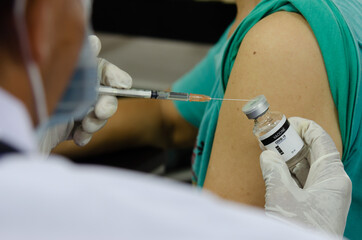 Doctors do vaccinations against viruses and treatment of plague. COVID-19 for people who want to...