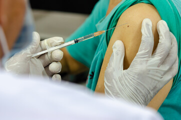 Doctors do vaccinations against viruses and treatment of plague. COVID-19 for people who want to...