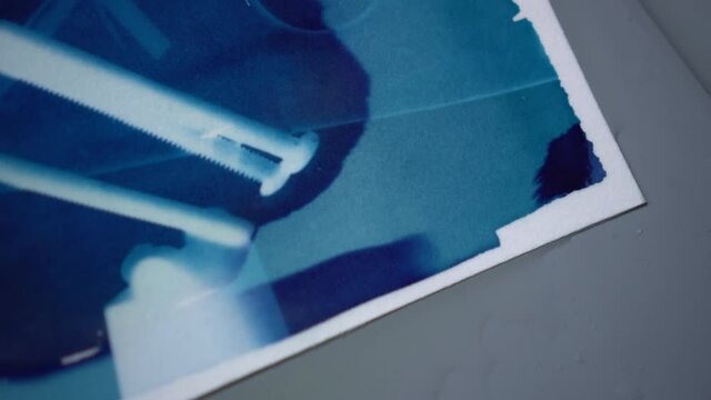 Cyanotype blue color art printing using chemical mix sun and shadow interaction