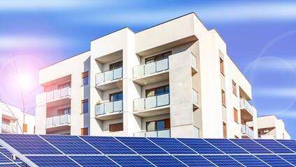Fototapeta premium solar panels and facade of apartment building, green energy