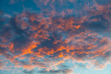 Scenic evening clouds painted by the rays of the setting sun