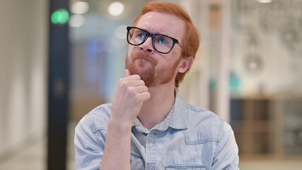 Pensive Young Redhead Man Thinking, Brainstorming