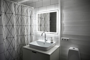 Bathroom in white color. Large washbasin. Mirror with built-in diode tape illumination switching by...