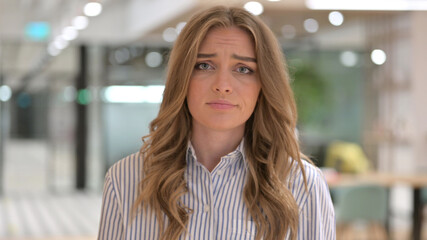 Fototapeta premium Portrait of Businesswoman reacting to Loss, Failure