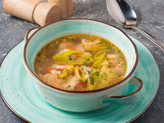 fish soup with white and red fish in the restaurant