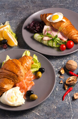 croissant with smoked salmon and the croissant with ham. Concept: Breakfast