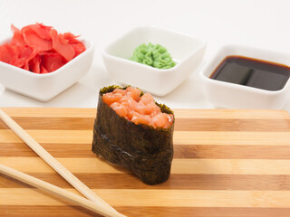 gunkan with salmon on a wooden Board. Japanese cuisine