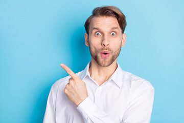 Portrait of attractive cheerful amazed guy demonstrating copy empty space pout lips ad isolated...
