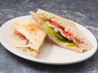 sandwich or toast with chicken breast and vegetables. Concept: healthy eating
