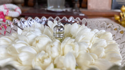 Fragrant oils bottle in the middle jasmine
, Buddhist beliefs use fragrant oils and  Items that smell fragrant to worship Buddha images.