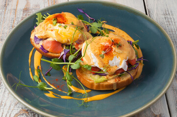 wheat bun with salmon and poached egg. Concept: Breakfast