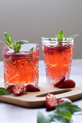 Refreshing summer drink with strawberry and mint