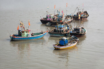 Fototapeta na wymiar Anchored fishing boats, Harnai Port, Konkan, Maharashtra, India