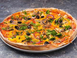 vegetarian pizza with tomatoes, bell peppers, cheese and mushrooms