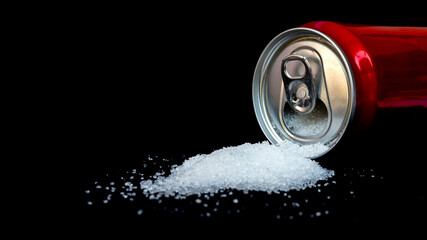 Cans of sugary drinks pour out separately on black background, concept of comparing sugar content...