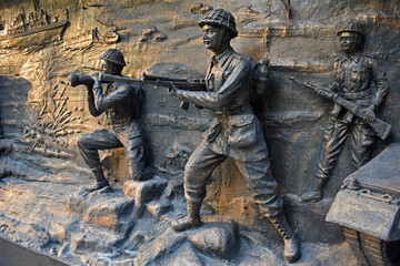 Fototapeta na wymiar Soldiers war sculpture wall relief at Museum - National War Memorial Southern Command Pune, Maharashtra, India