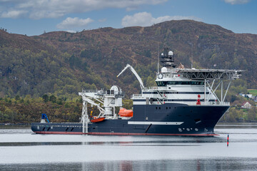 ULSTEINVIK, NORWAY - 2020 MAY 07. Multipurpose Offshore Vessel with big offshore crane inside the Norwegian fjord