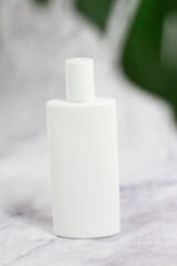White plastic cosmetic bottle, sunscreen, cream, oil, facial hand skin care 