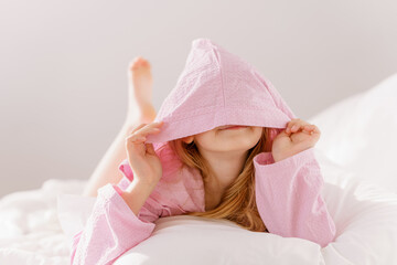 girl resting in a bathrobe - obrazy, fototapety, plakaty