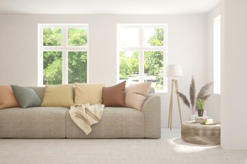 White living room with sofa and summer landscape in window. Scandinavian interior design. 3D illustration