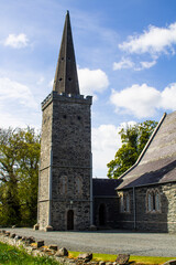 Fototapeta na wymiar he historic Bell Tower of St Saviour's Parish Church in Greyabbey on the Ards Peninsula in County Down