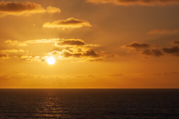 Orange fascinated bright sunset in spring  in nature park of Jandía