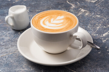 medium cappuccino Cup on a grey background