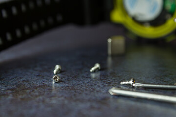 close-up of wristwatch repair, screwdriver, screws