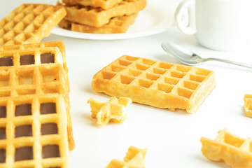 Sweet carbohydrate waffles, delicious calories on white background, slices isolated