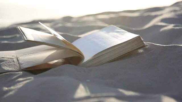 Book turning page with the wind