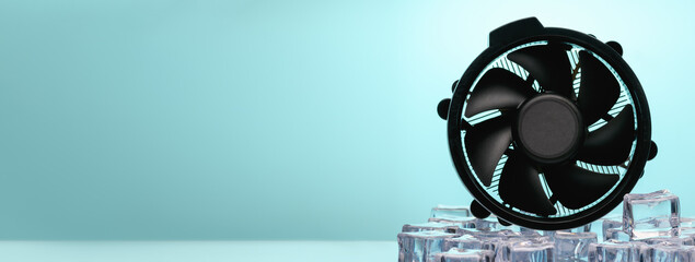 Computer cooling fan in ice with blue backlight. Cooler cooling concept. Banner