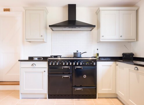 Modern modular kitchen interior, range cooker and chimney hood