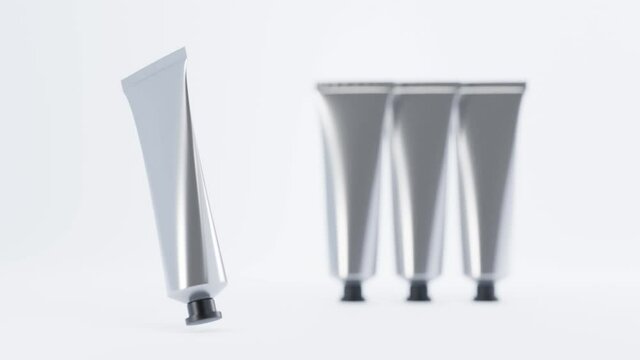 Collection metal tubes hand cream or set oil paints. Cosmetic aluminium mock up, presentation and ad of blank silver packaging for toothpaste, glue or medical product on white background, 3d animation