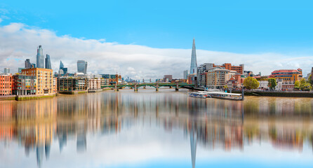Fototapeta na wymiar Skyline of London on the Thames River - London, United Kingdom