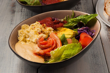 poke with salmon, avocado, omelet and vegetables