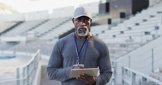 African american male coach looking at camera and smiling
