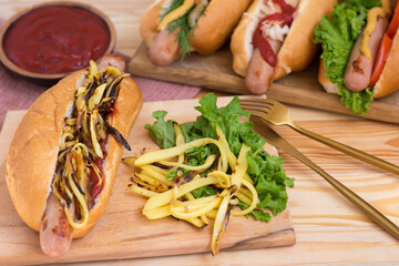 hot dog with potatoes and chips. Hot dog with tomato