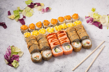 set of sushi rolls on a gray background