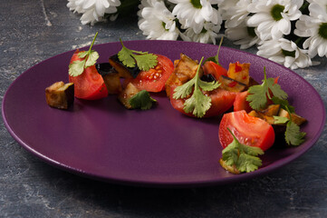 salad of fresh tomatoes and fried eggplant. Horizontal frame
