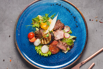 grilled salad with beef, eggplant, tomatoes and bell pepper. Top view