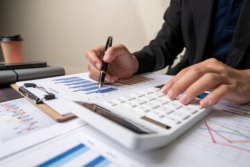 Fototapeta premium bookkeeper or financial inspector hands making report, calculating or checking balance. Home finances, investment, economy, saving money or insurance concept