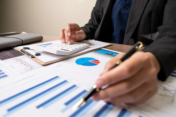 Business people or accountants are analyzing graphs on finance, investment, graph chart business strategy ideas, data analysis technology.