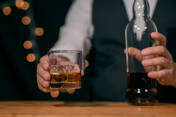Barman pouring whiskey whiskey glass beautiful night