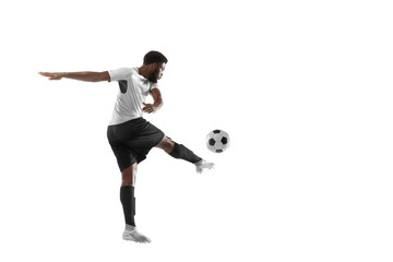Fototapeta na wymiar Young African football soccer player training isolated on white background. Concept of sport, movement, energy and dynamic.
