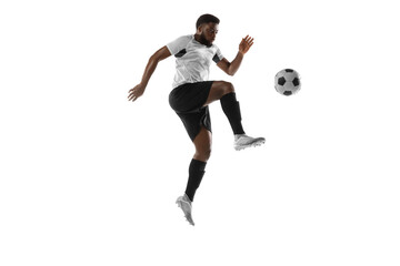 Young African football soccer player training isolated on white background. Concept of sport,...