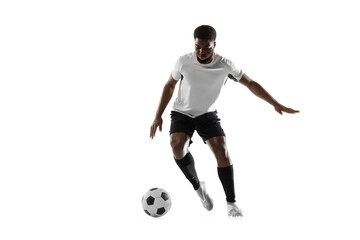 One African man football player training isolated on white background. Concept of sport, movement,...